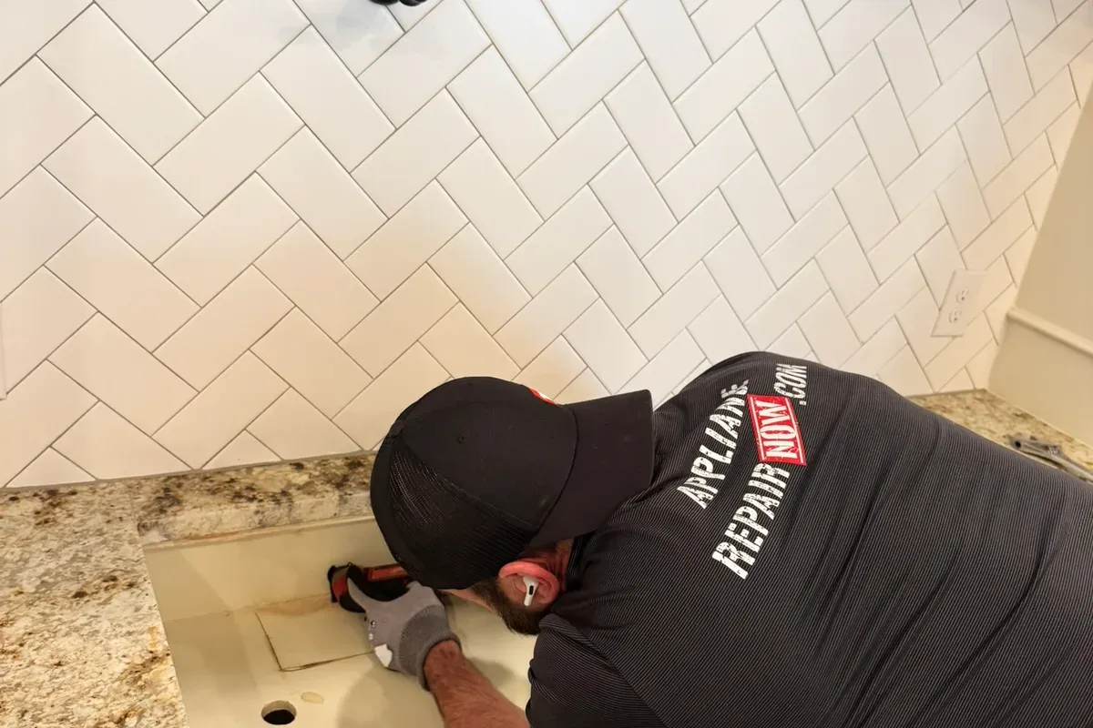 New appliance being leveled and connected during installation